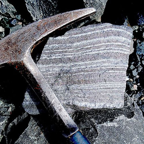 A Banded Iron-Formation (BIF) with bands of iron-oxide (black) and quartz (white) that were deposited at the seafloor some 2700 million years ago. (Source: Jacobs University)