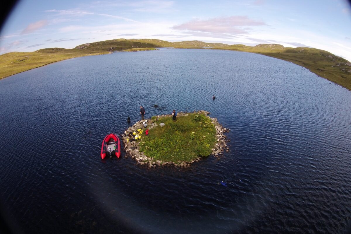 Aerial view of the crannog at Loch Langabhat. Previously published in: Garrow, D., & Sturt, F. (2019). Neolithic crannogs: Rethinking settlement, monumentality and deposition in the Outer Hebrides and beyond. Antiquity, 93(369), 664-684. doi:10.15184/aqy.2019.41. Image credit : Fraser Sturt