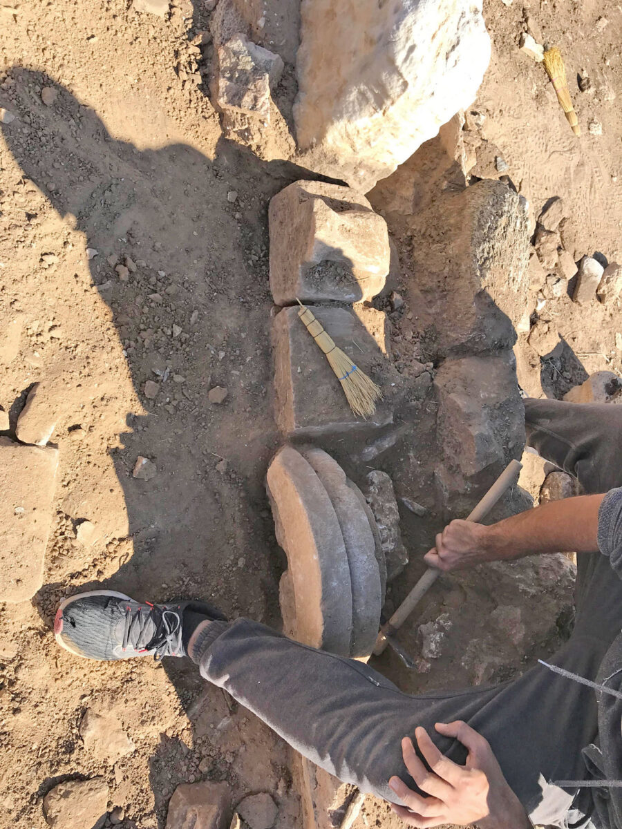 Archaic seated statue and marble votive base of the Archaic period as found inside a later wall outside the sanctuary’s enclosure (Image source source: MOCAS)