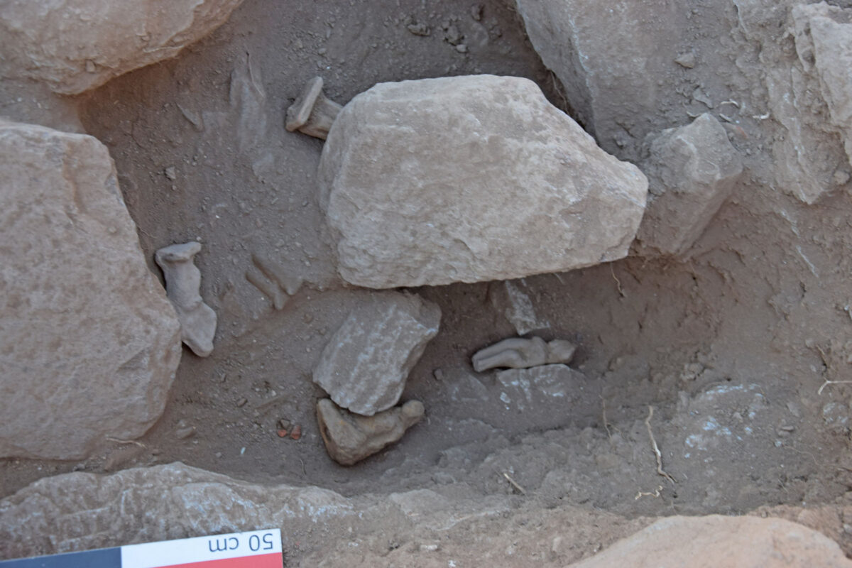 Fig. 11. Building 3. Cavity with votive offerings in a recess of the rock.