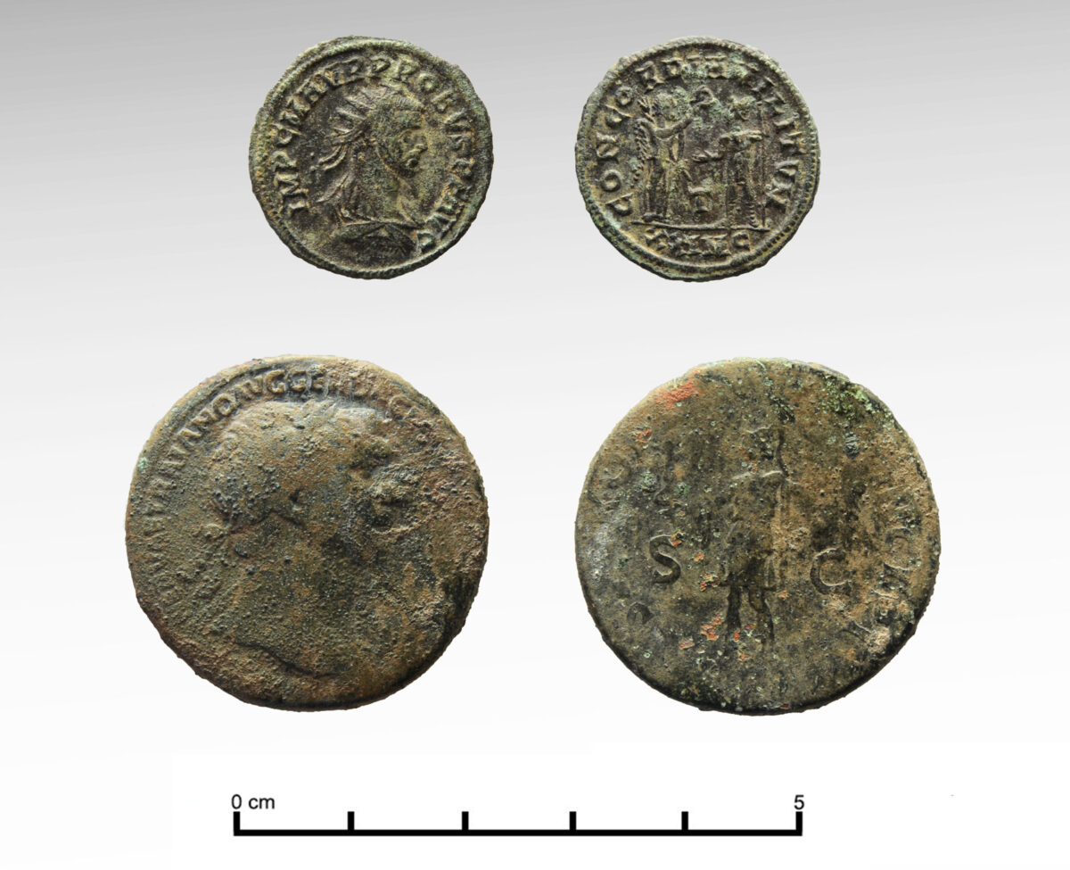 Fig. 25. Bronze Roman coins (below: sestertius of Trajan, after 106 AD; top: coin of Diocletian, ca.  285 AD).