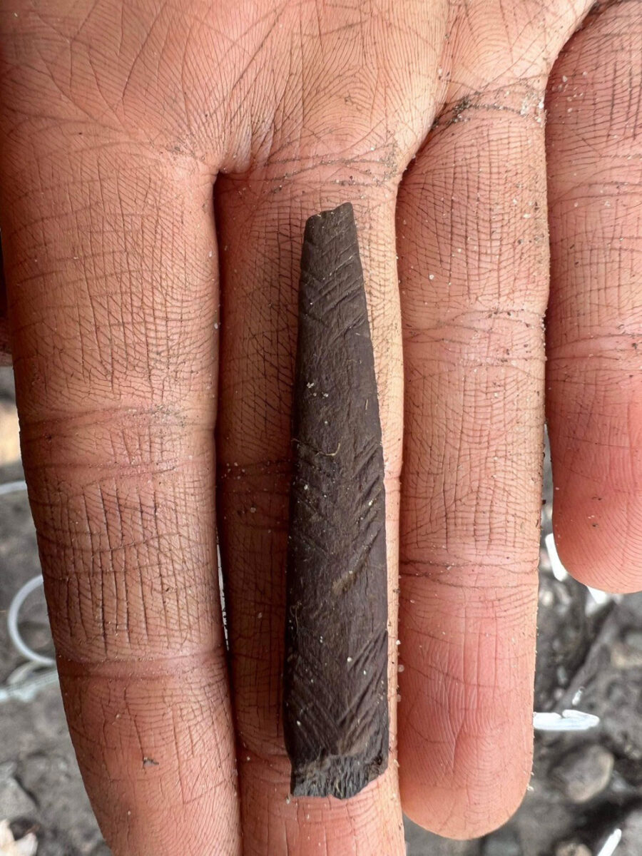 A decorated antler point.
