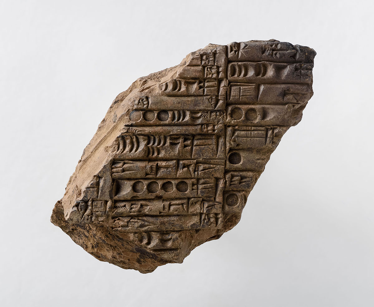 An Old Akkadian administrative clay tablet (c. 2,350-2,200 BC) listing quantities
of barley in cuneiform, belonging to the palace archives of Girsu, rescued from Tablet
Hill, Girsu, Iraq. Conserved and sent to the Iraq Museum in Baghdad, 2022. © The
Girsu Project