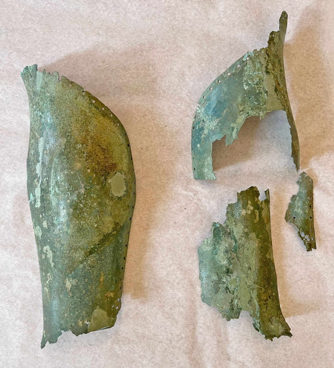 Pair of bronze greaves with holes lining the upper edges to secure the coating. Dated to the Classical period. Image credit: Ministry of Culture and Sports.