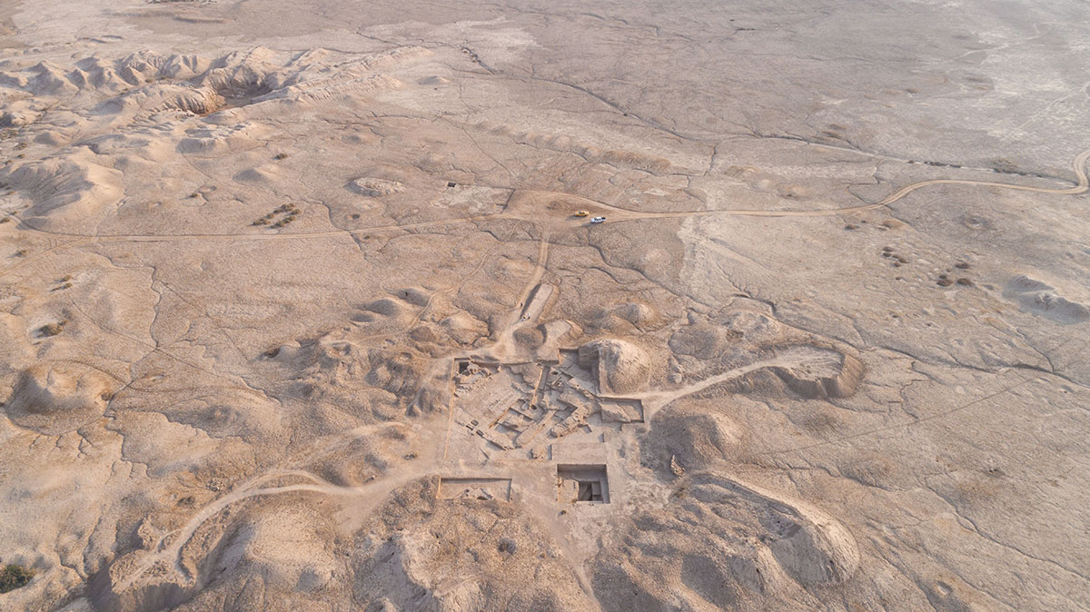 Aerial view of the Temple mound, looking south, showing the walled sacred
precinct in the distance at Girsu, Southern Iraq. Remains from successive periods,
from 3,000 BCE TO 2,000 BCE. Photo by Sébastien Rey © The Girsu Project