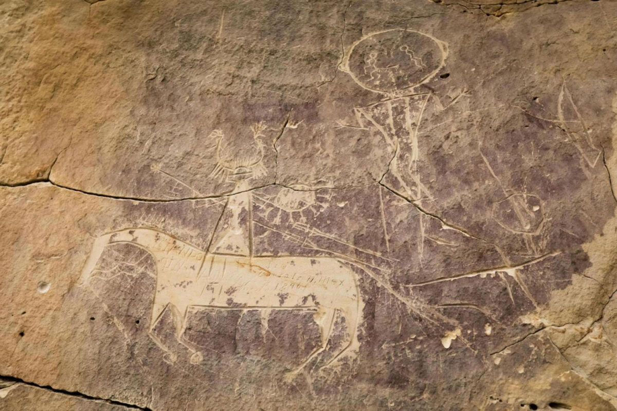Horse and rider petroglyphs at the Tolar site located in Sweetwater County, Wyoming, likely carved by ancestral Comanche or Shoshone people. (Credit: Pat Doak)