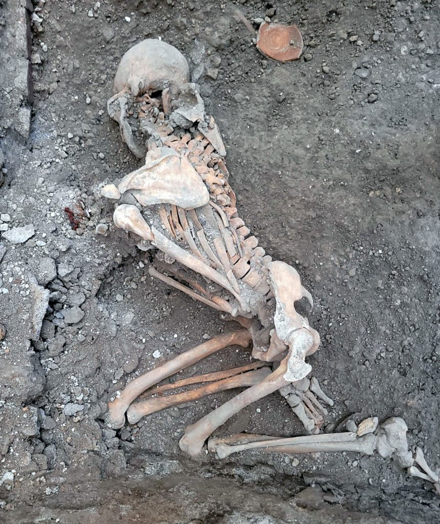 The skeletons were found lying on one side in a utility room. © Pompeii Sites