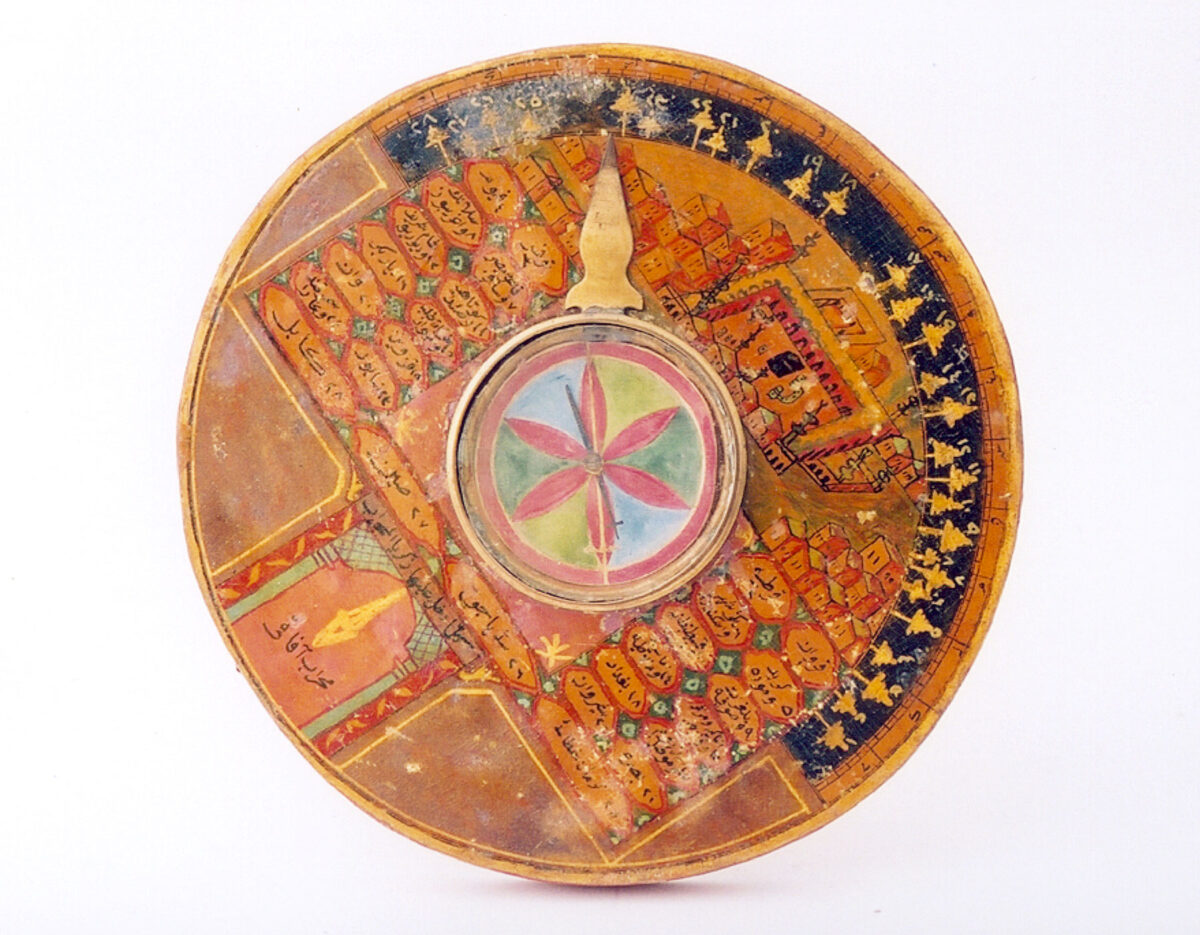 Compass orientated to Mecca with a depiction of its mosque from a region of the Ottoman Empire, 19th c. Wood, copper. Benaki Museum, Islamic Collection ΓΕ 14715.
