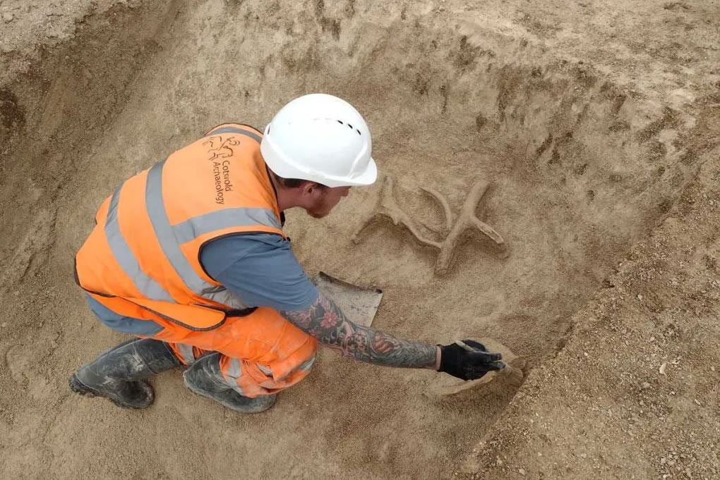 Archaeologist Jordan Bendall, excavating the antler picks.