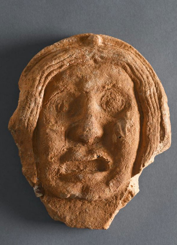 Roof tile in the shape of a human face, AD 55-65 (ceramic).