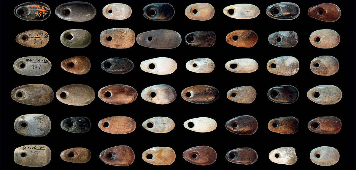 Selection of oval bone beads bearing traces of red pigments dating back to the old Natufian period (13,050-12,550 to 11,550 BC).