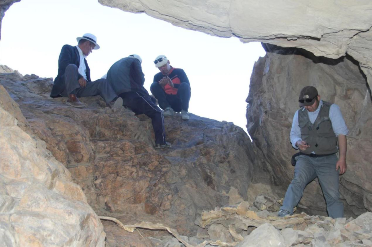 Jamsranjav Bayarsaikhan, right, with a team of archaeologists excavate the Urd Ulaan Uneet cave site. (Credit: Jamsranjav Bayarsaikhan)