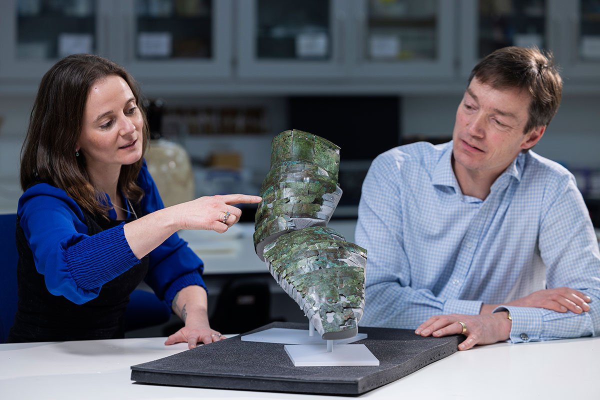 Conservator Bethan Bryan and Curator Dr Fraser Hunter with the Roman arm guard. Photo (c) Duncan McGlynn (2). 