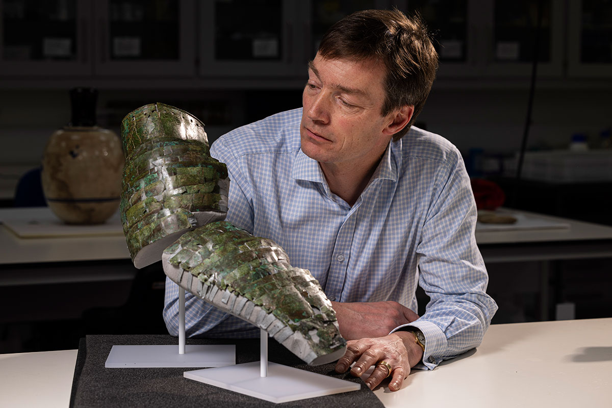 Curator Dr Fraser Hunter with the Roman arm guard. Photo (c) Duncan McGlynn (10)-2. National Museums Scotland
