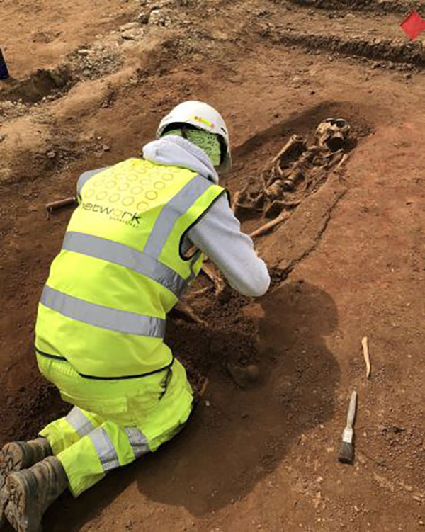 Excavating a skeleton from a site in Lincoln. Image credit: Network Archaeology.