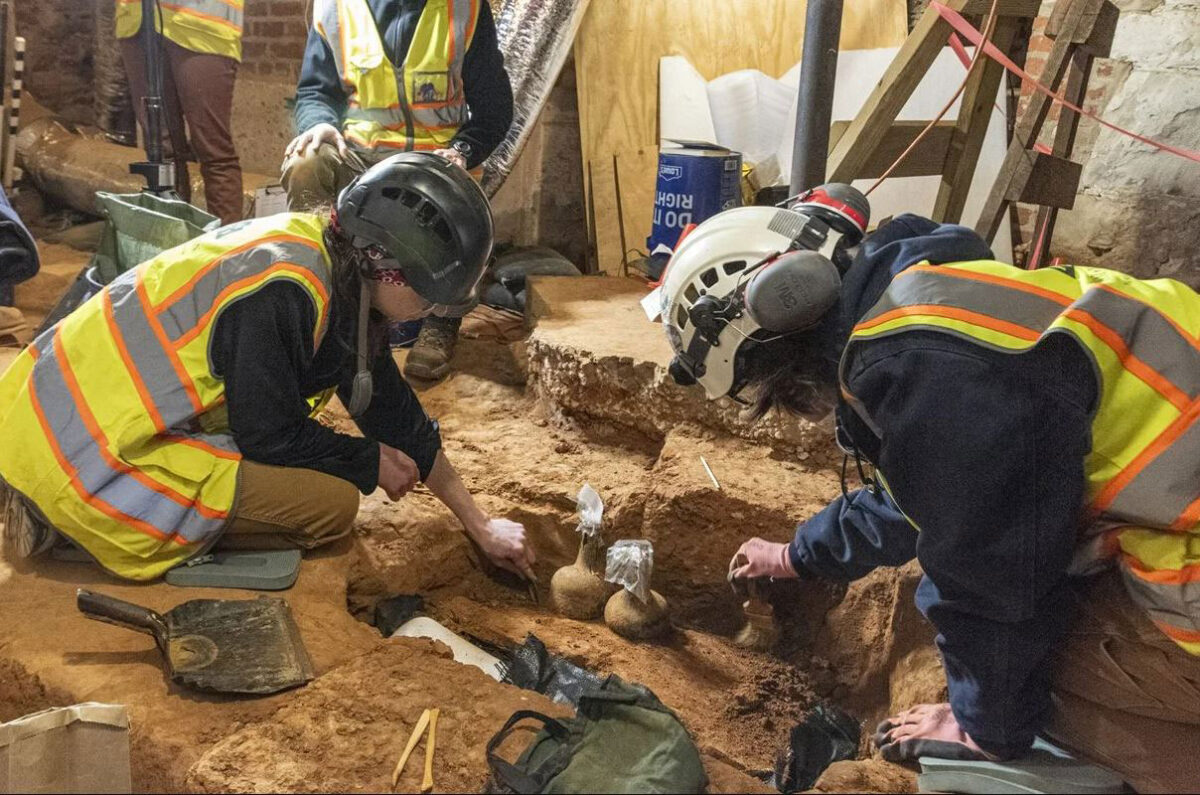 Archaeologists discover sealed 18th century glass bottles