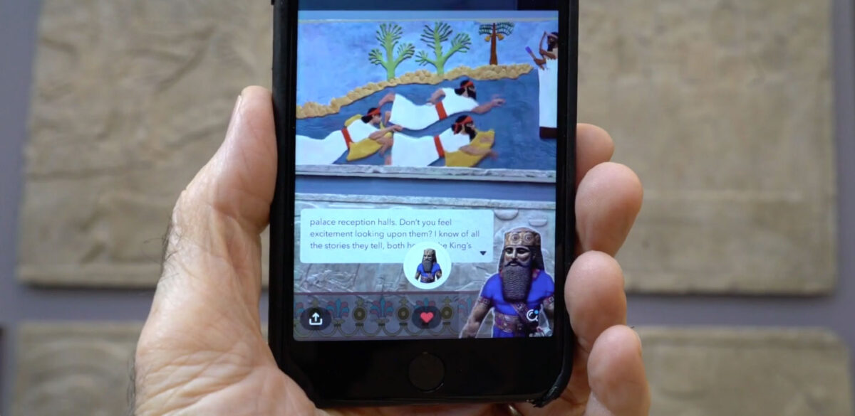 Palace overseer Dan-Assur (lower right) narrates an animated scene when a phone is aimed at a wall sculpture in the Harvard Museum of the Ancient Near East gallery. Still photo from The Making of Art of Intimidation video. © President and Fellows of Harvard College