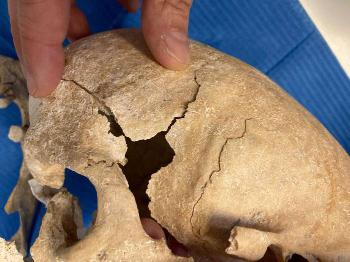 Body of a woman among the remains of 25 warrior monks