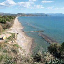 View of the beach of Plaka at Drepano from Asini. In the background, the 'Nisi' peninsula.
