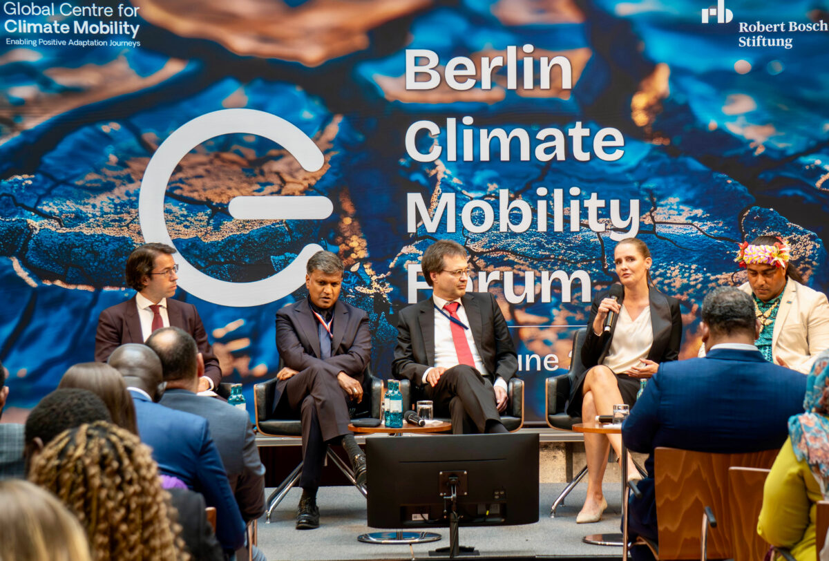 Fig. 1: from left to right: Andrea Milan (GCCM), Ashok Adicéam (Deputy Special Envoy of the President of France/UNOC3 Managing Director), Annette Kühlem (DAI), Volker Erhard (German Federal Foreign Office) and Kato Ewekia (GCCM Fellow) during the panel discussion at the Berlin Climate Mobility Forum © Sebastian Dobberstein // DAI