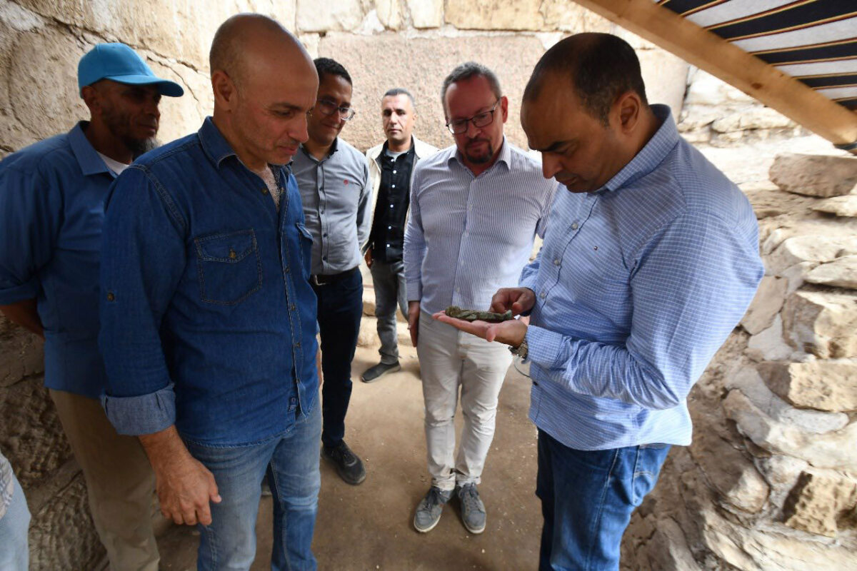 Experts and heritage officials examining one of the ushabtis. Image: MoTA Egypt.